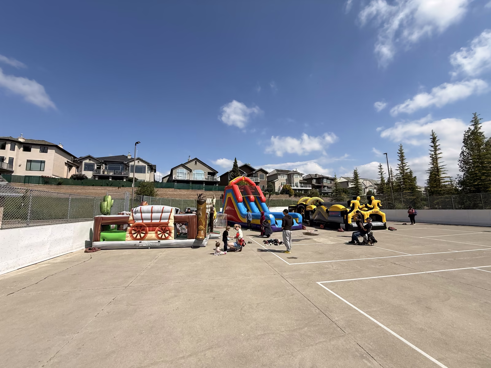 Wide view of the three inflatables on the sport court