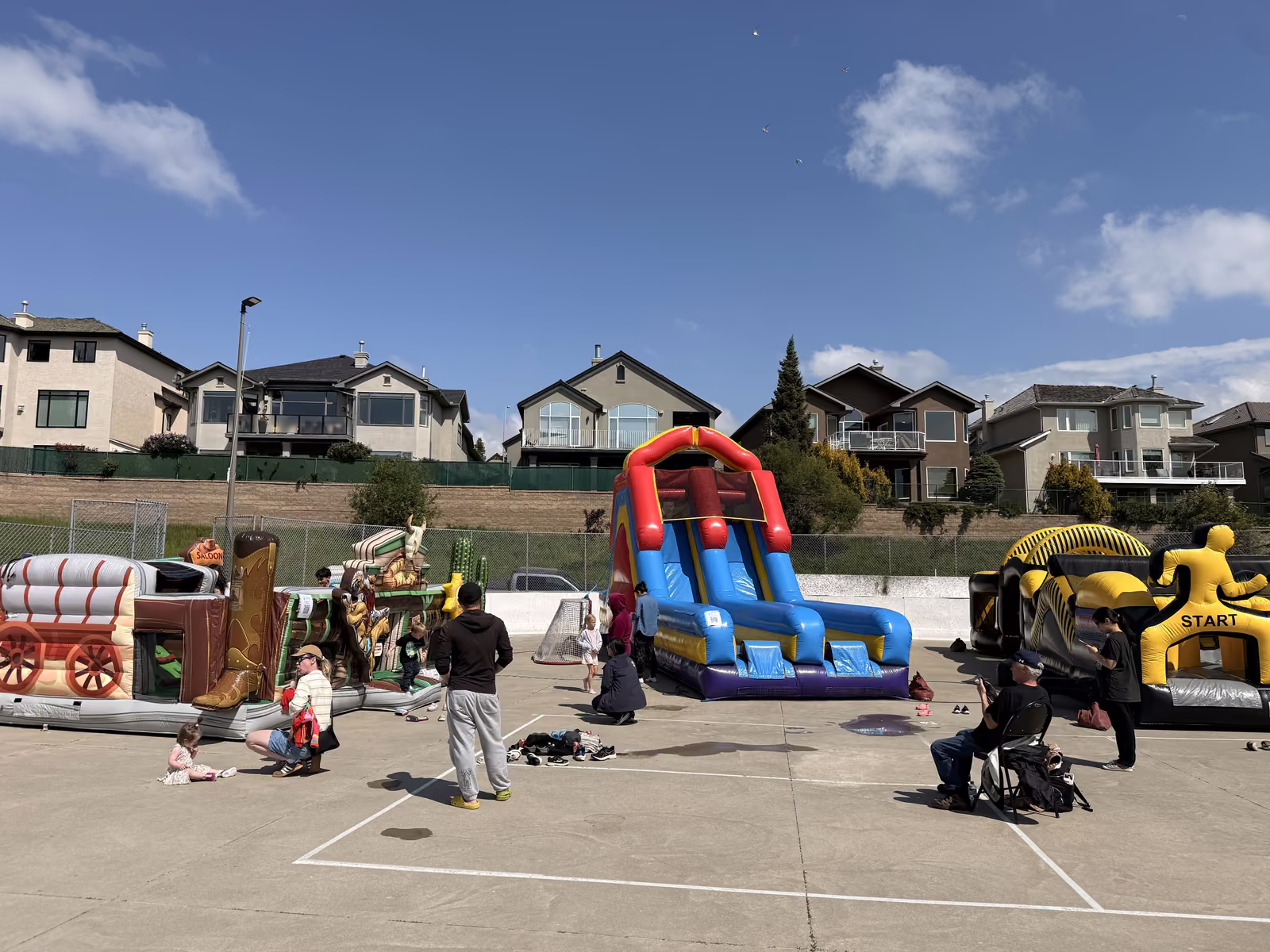 Kids racing down the giant inflatable slide