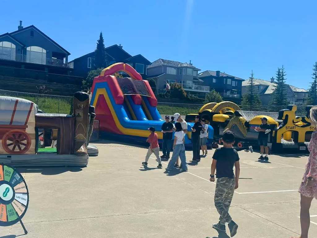 The prize wheel beside the inflatables